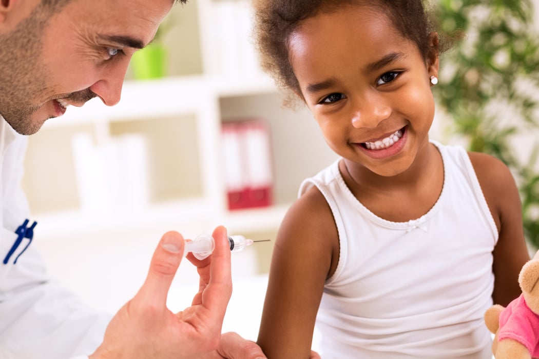 Little happy girl get an injection covid vaccine coronavirus childhood vaccins