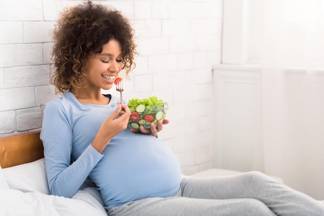 pregnant woman eating salad pregnancy mediterranean diet