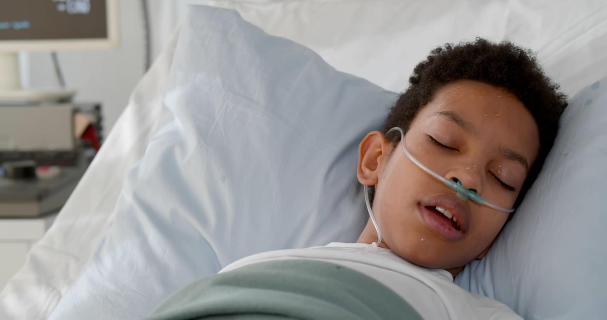 black kid in hospital bed covid vaccine 