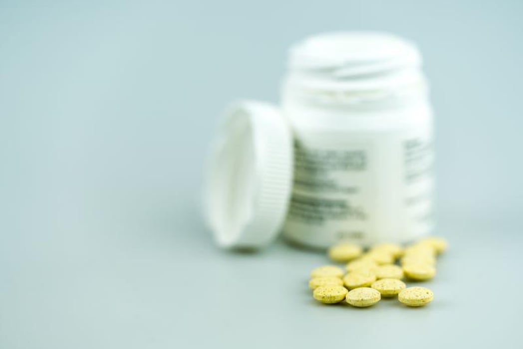 yellow pills drugs bottle prescription