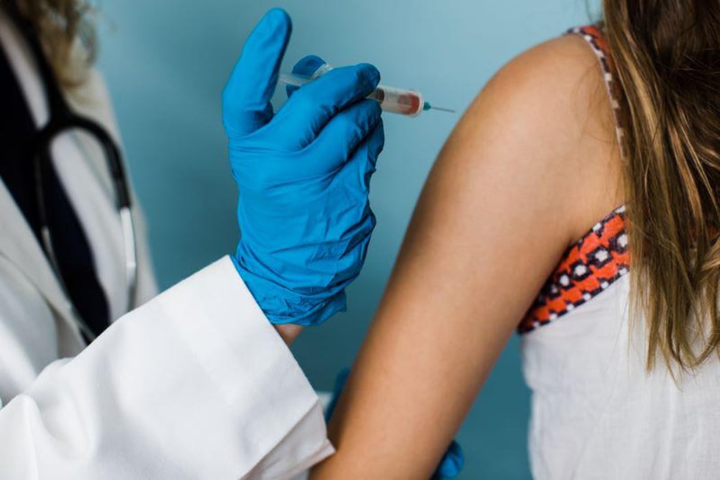 COVID-19 vaccine in the arm of a pregnant woman
