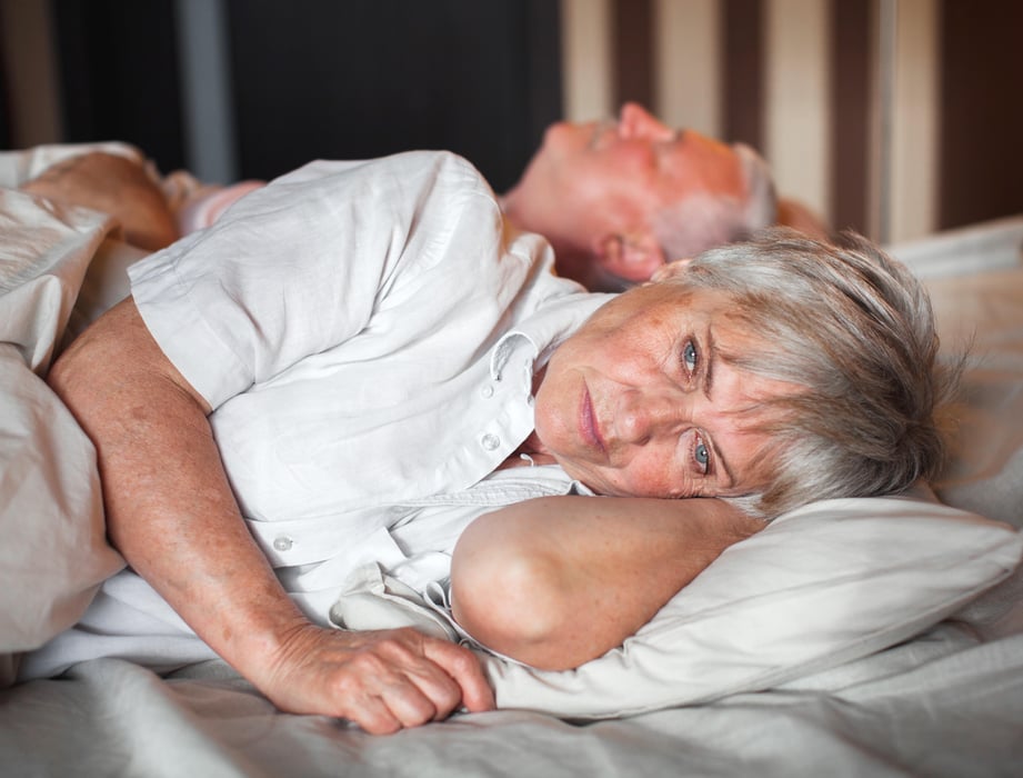 unhappy couple bed snore
