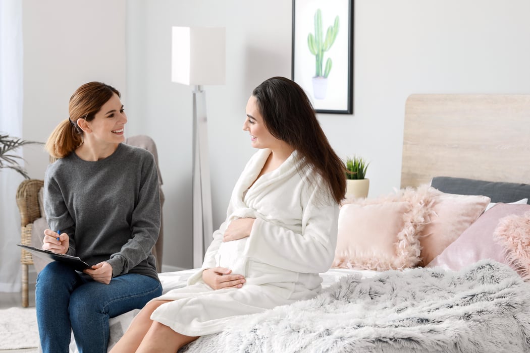 woman counseling pregnant woman on childbirth